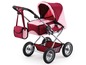 Ein rosa und roter Puppenwagen mit einer Tasche.