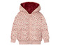 Eine rosa Mädchenjacke mit Blumenmuster und Kapuze.