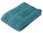 Ein zusammengefaltetes Handtuch in Teal.