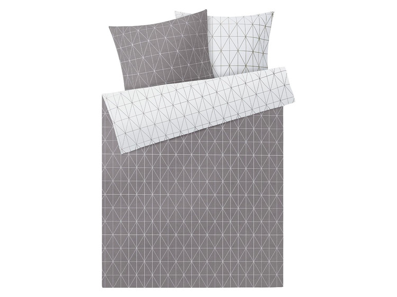 Ein grauer Bettbezug mit einem weißen geometrischen Muster.