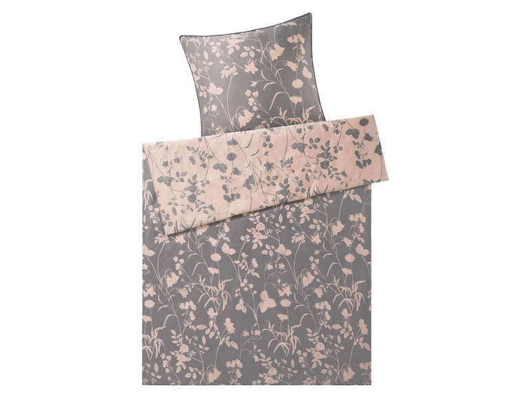 Ein Bettbezug mit Blumenmuster in Grau- und Rosatönen.