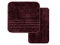 Zwei dunkelviolette Badezimmermatten