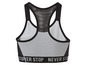 Grauer Sport-BH mit Mesh und dem Slogan 'Never Stop'.