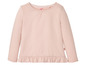 Rosa Langarmshirt mit Rüschen für Mädchen.