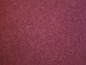 Burgunderfarbene Textur eines Samtstoffes.