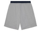 Graue Shorts mit dunkelblauem Bund.