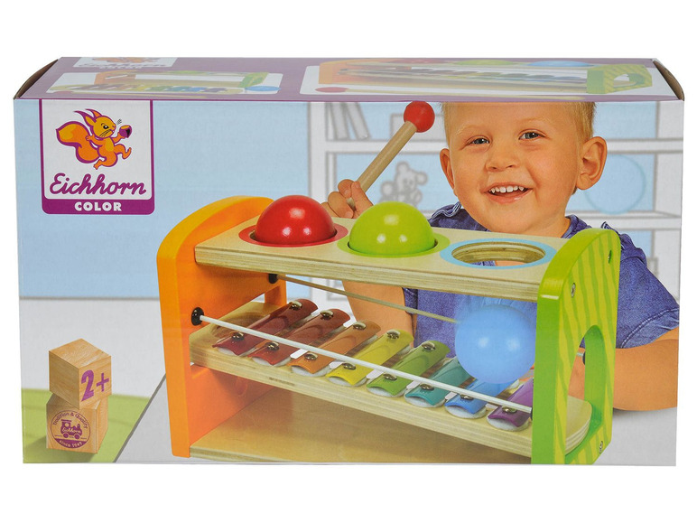 Ein Eichhorn Color Holzspielzeug-Set mit Xylophon, Hammer und Bällen.