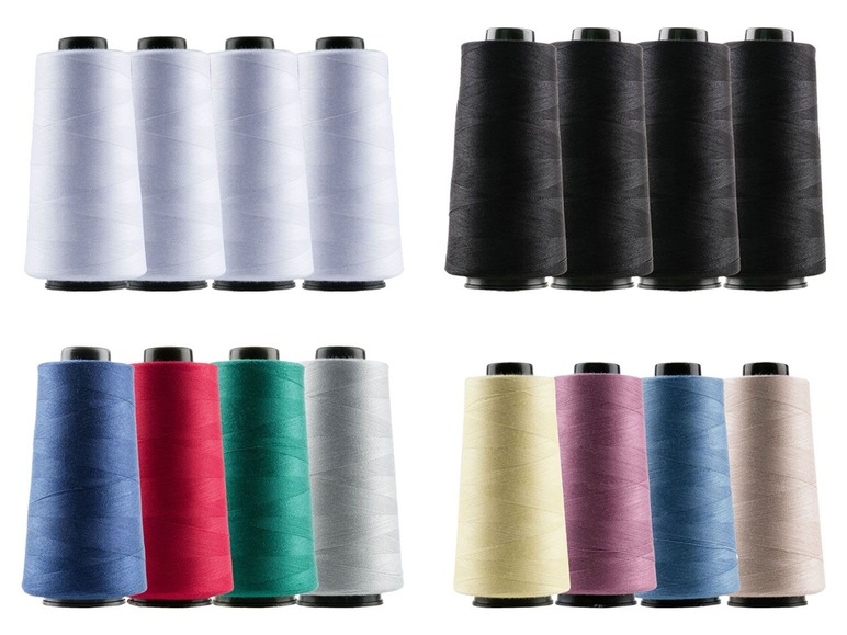 Spulen mit Garn in verschiedenen Farben, darunter Weiß, Schwarz, Blau, Rot, Grün und Beige.
