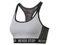 Ein grauer Sport-BH mit Mesh-Einsätzen und dem Schriftzug 'Never Stop'.
