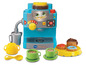 VTech Spielzeug Kaffeemaschine mit Tassen und Gebäck.