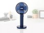 Blauer Unold Tischventilator mit drehbarem Kopf.