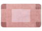 Rosa Badezimmermatte mit geometrischem Muster.