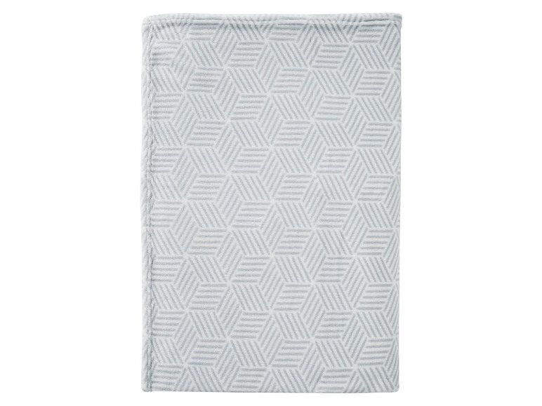 Eine graue Decke mit geometrischem Muster.