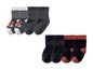 Graue und schwarze Babysocken mit rutschfesten Punkten und Tier- und Fahrzeugmotiven.