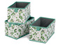 Drei Aufbewahrungsboxen mit grünem Blättermuster.
