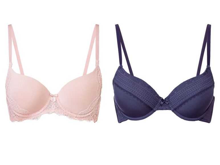 Zwei BHs, einer rosa mit Spitze und einer dunkelblau mit Spitze.