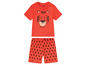 Ein orangefarbenes Baby-Set mit Tiger-Print auf dem Shirt und einem geometrischen Muster auf der Hose.