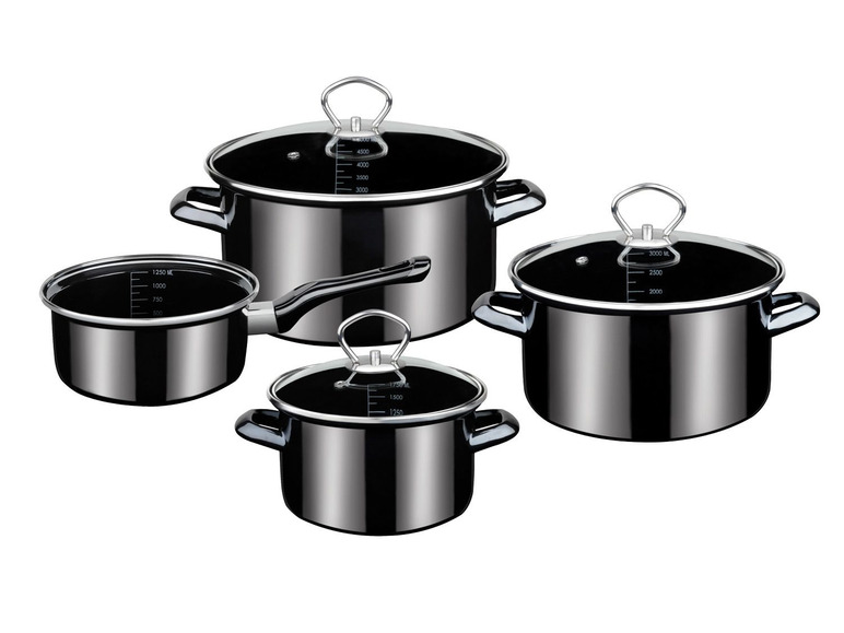 Ein Satz mit vier schwarzen Töpfen mit Glasdeckeln.