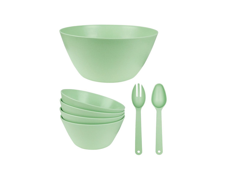 Grüne Schüsseln und Besteck, perfekt für Salate.