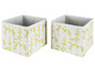 Zwei weiße Aufbewahrungsboxen mit gelbem Blumenmuster.