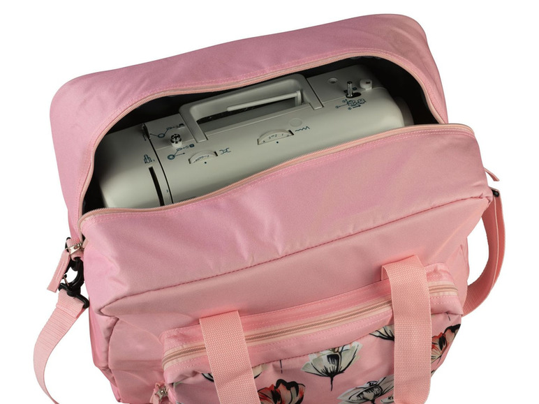 Eine rosa Tasche mit einer Nähmaschine darin.