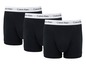 Drei schwarze Calvin Klein Boxershorts.