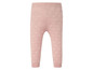 Rosa Baby Leggings mit weißen Punkten.