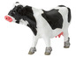 Eine schwarz-weiße Plastikkuh, ein Spielzeug für Kinder.