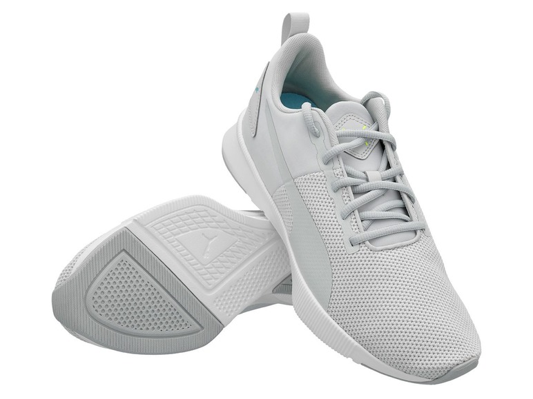 Graue Puma Laufschuhe mit Mesh-Obermaterial.