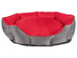 Ein rotes und graues Hundebett.
