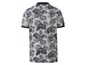 Ein graues Poloshirt mit tropischem Muster.