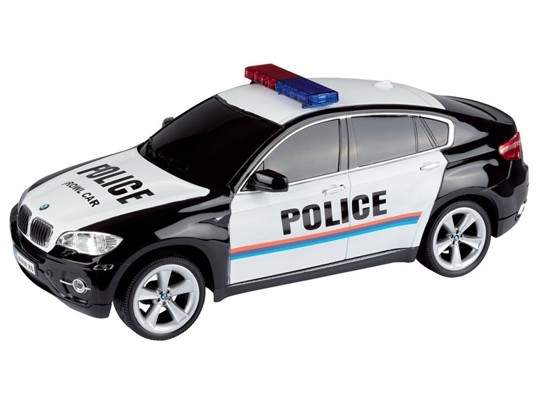 Ein schwarzes BMW Polizei-Auto mit blinkendem Blaulicht.