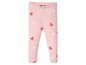 Rosa Leggings mit weißen und roten Herzen.