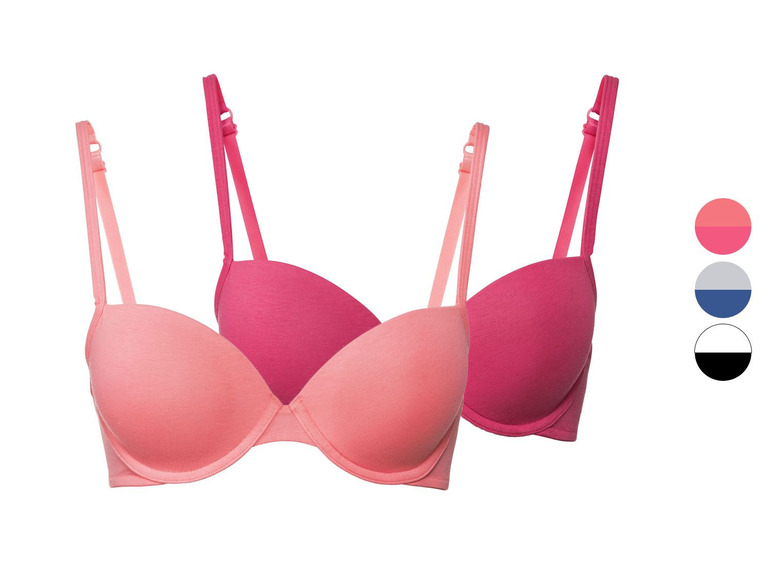 Zwei rosafarbene BHs mit Bügeln.