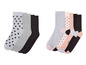 Ein Set mit sechs Socken mit Sternen und Punkten.