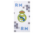 Ein weißes Handtuch mit dem Real Madrid Logo und dem Text 'RM'.