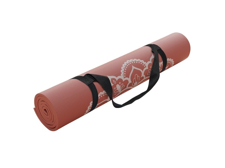 Eine rosafarbene Yogamatte mit Mandala-Muster und schwarzen Trageriemen.