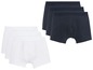 Drei Paar Boxershorts, zwei weiße und ein dunkelblauer.