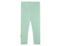 Mintgrüne Leggings mit einem fröhlichen Muster.