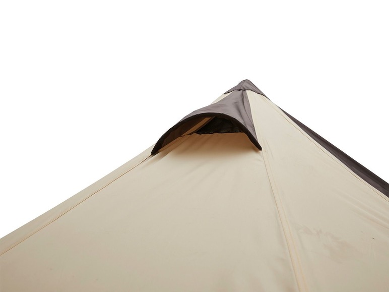 Die Spitze eines beigefarbenen Zeltes mit einem dunkelbraunen Lüftungsloch.