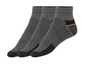 Drei Paar graue Socken mit schwarzen und gelben Akzenten.