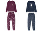 Zwei Pyjama-Sets mit Sonnen-, Mond- und Sternenmuster.