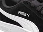 Schwarze Puma Sneaker aus Leder mit weißem Streifen.