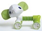 Ein grüner und weißer Spielzeug-Elefant mit Rädern