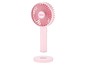 Ein rosa tragbarer Ventilator von Unold mit Ladestation.