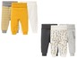 Sechs Babyhosen in verschiedenen Farben und Mustern, darunter Streifen und Giraffen.