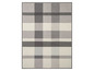Eine Plaiddecke mit grau-weißem Karomuster.