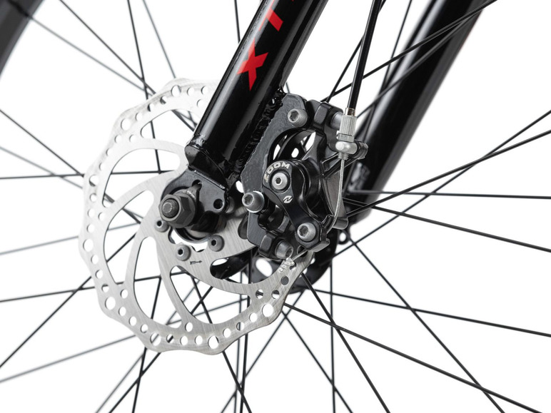 Nahaufnahme eines Fahrradreifens mit Scheibenbremse.