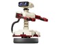 Eine R.O.B. amiibo-Figur mit einem Nintendo-Controller.