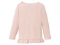 Ein rosa Langarmshirt mit Rüschen für Babys.